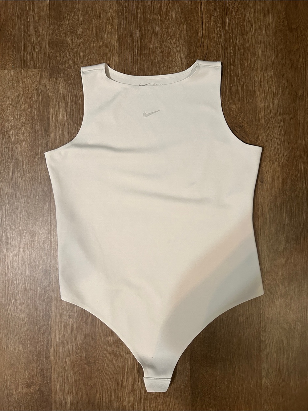 Nike Cream-White Sleeveless Women’s Bodysuit with Small Swoosh